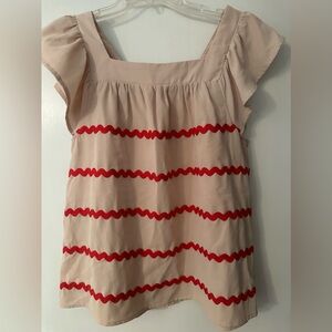 Khaki shirt with red decor